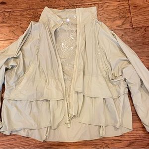 Free people movement pistachio green ruffle layered wind breaker